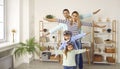 Happy little children together with their parents playing and flying planes at home Royalty Free Stock Photo