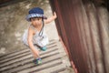 Happy little cute girl walking up the stairs. Royalty Free Stock Photo