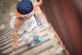 Happy little cute girl walking up the stairs. Royalty Free Stock Photo