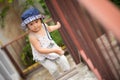 Happy little cute girl walking up the stairs. Royalty Free Stock Photo