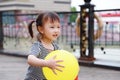 Happy little cute lovely girl Chinese child smile laugh play colorful balloon have fun at summer park nature happiness childhood Royalty Free Stock Photo