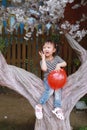 Happy little cute lovely girl Chinese child smile laugh play red balloon have fun at summer park nature happiness childhood Royalty Free Stock Photo