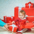 Happy little dreamy girl with christmas gift box. Happy holiday. Happy christmas. Family winter holidays and people Royalty Free Stock Photo