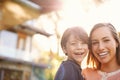 Happy little family. Portrait of a young mother holding her happy son outside. Royalty Free Stock Photo