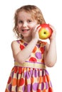 Happy little girl with an apple in his hand