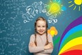 Happy little girl with art and sience design element, brain sketch. Royalty Free Stock Photo