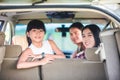 Happy little girl with asian family sitting in the car for enjo Royalty Free Stock Photo