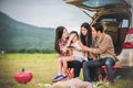 Happy little girl with asian family sitting in the car for enjo Royalty Free Stock Photo