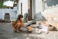 Asian playing with cat at java traditional home Royalty Free Stock Photo