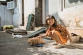Asian playing with cat at java traditional home Royalty Free Stock Photo