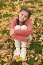 Happy little girl in autumn forest. Autumn leaves and nature. Small child with autumn leaves. Happy childhood. School Royalty Free Stock Photo