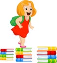 Happy little girl with a backpack walking on a pile of books