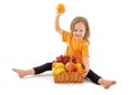 Happy little girl with basket of fruits Royalty Free Stock Photo