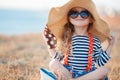 The happy little girl in a big hat Royalty Free Stock Photo