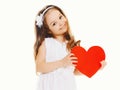 Happy little girl with big red paper heart Royalty Free Stock Photo