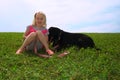 Happy Little Girl and Black Labrador Retriever