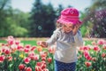 Happy little girl blowing soap bubbles in summer park Royalty Free Stock Photo