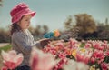 Happy little girl blowing soap bubbles in summer park Royalty Free Stock Photo