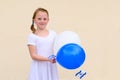 Happy little girl with blue and white balloons ans Israel flag. Royalty Free Stock Photo