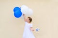Happy little girl with blue and white balloons ans Israel flag. Royalty Free Stock Photo