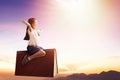 Happy little  girl on book and  flying in the sky Royalty Free Stock Photo