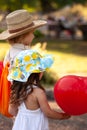 Little girl and boy with balloons in the park Royalty Free Stock Photo