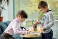 Happy little girl and boy drawing at home Royalty Free Stock Photo