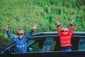 Happy little girl and boy travel by car in nature Royalty Free Stock Photo