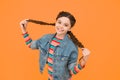 Happy little girl with braids wear denim clothes, modern style concept