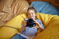 Happy little girl with camera, child blogger