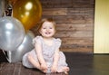 Happy little girl celebrate her first birthday party with balloons Royalty Free Stock Photo