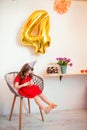 Happy little girl celebrating the fourth birthday at home Royalty Free Stock Photo