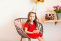 Happy little girl celebrating the fourth birthday at home Royalty Free Stock Photo