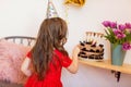 Happy little girl celebrating the fourth birthday at home Royalty Free Stock Photo