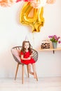 Happy little girl celebrating the fourth birthday at home Royalty Free Stock Photo