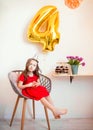 Happy little girl celebrating the fourth birthday at home Royalty Free Stock Photo