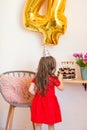 Happy little girl celebrating the fourth birthday at home Royalty Free Stock Photo