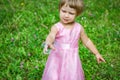 happy little girl chasing bubbles on nature in the park Royalty Free Stock Photo