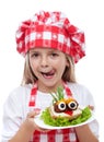 Happy little girl with chef hat and creative sandwich Royalty Free Stock Photo