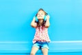 Happy little girl child listens to music in headphones Royalty Free Stock Photo