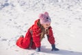 Happy little girl child playing on snow day. Christmas and Happy new year. Smiling kid on winter walk in nature. Royalty Free Stock Photo