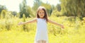 Happy little girl child walking in sunny summer park Royalty Free Stock Photo