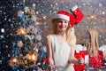 Happy Little girl with Christmas gift box. Cheerful cute Little girl opening a Christmas present. Opening gifts on Royalty Free Stock Photo