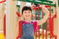 Happy little girl climbing on children playground Royalty Free Stock Photo