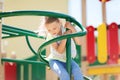 Happy little girl climbing on children playground Royalty Free Stock Photo