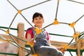 Happy little girl climbing on children playground Royalty Free Stock Photo