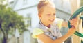 Happy little girl climbing on children playground Royalty Free Stock Photo