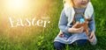 Happy little girl with collected Easter eggs in her hands