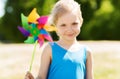 Happy little girl with colorful pinwheel at summer Royalty Free Stock Photo