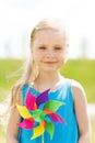 Happy little girl with colorful pinwheel at summer Royalty Free Stock Photo